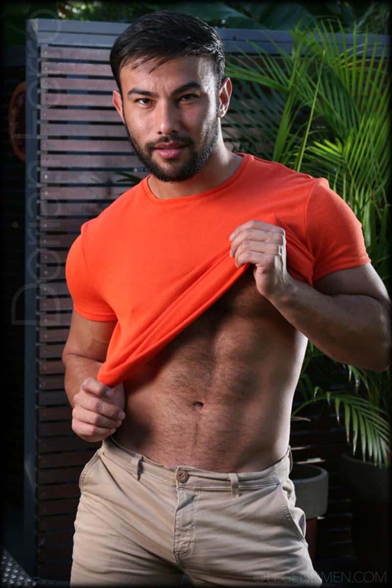 Sexy hairy muscle Latin stud Dorian Ferro strips out of his tight t-shirt jerking his huge uncut cock